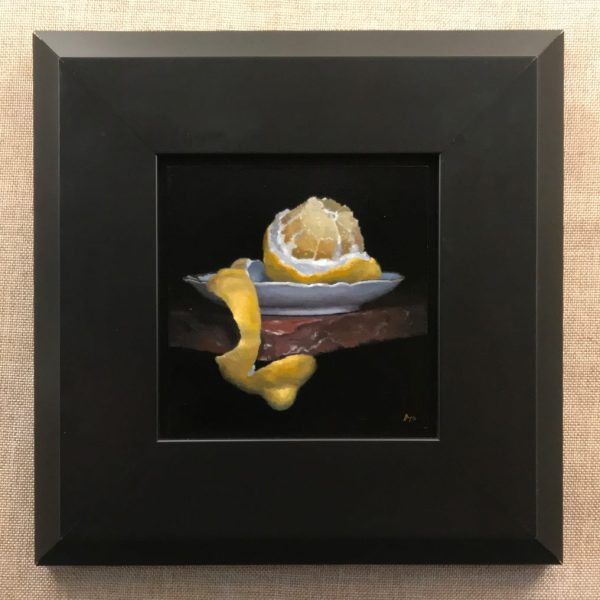 Peeled Lemon on Red Stone