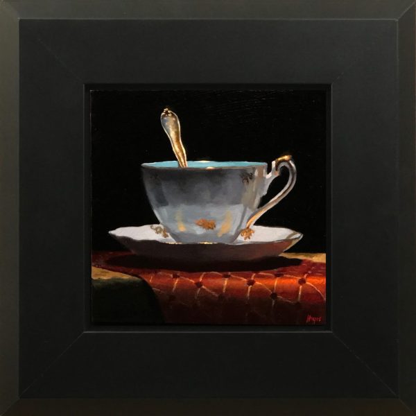 Gold-Trimmed Teacup and Red Brocade