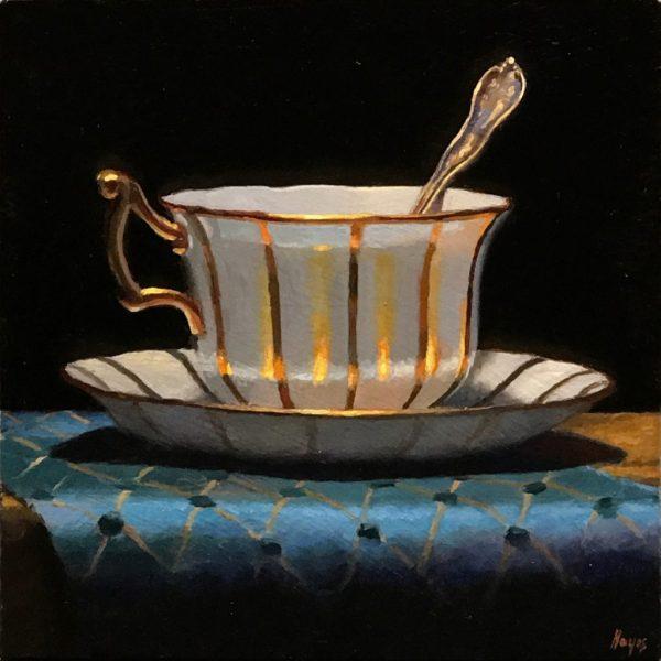 Gold-Trimmed Teacup and Blue Silk Brocade