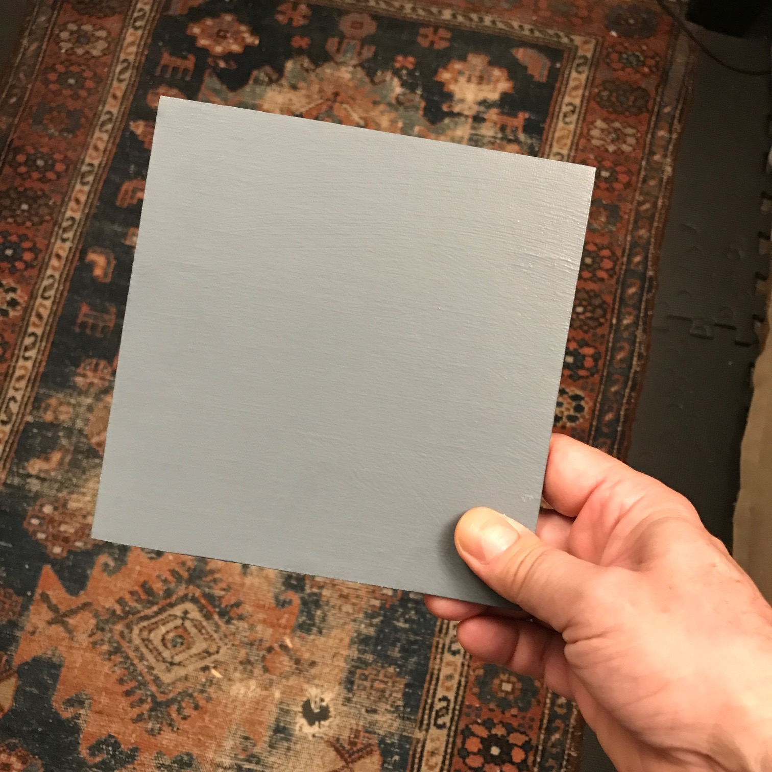 A panel with a mid-tone gray surface