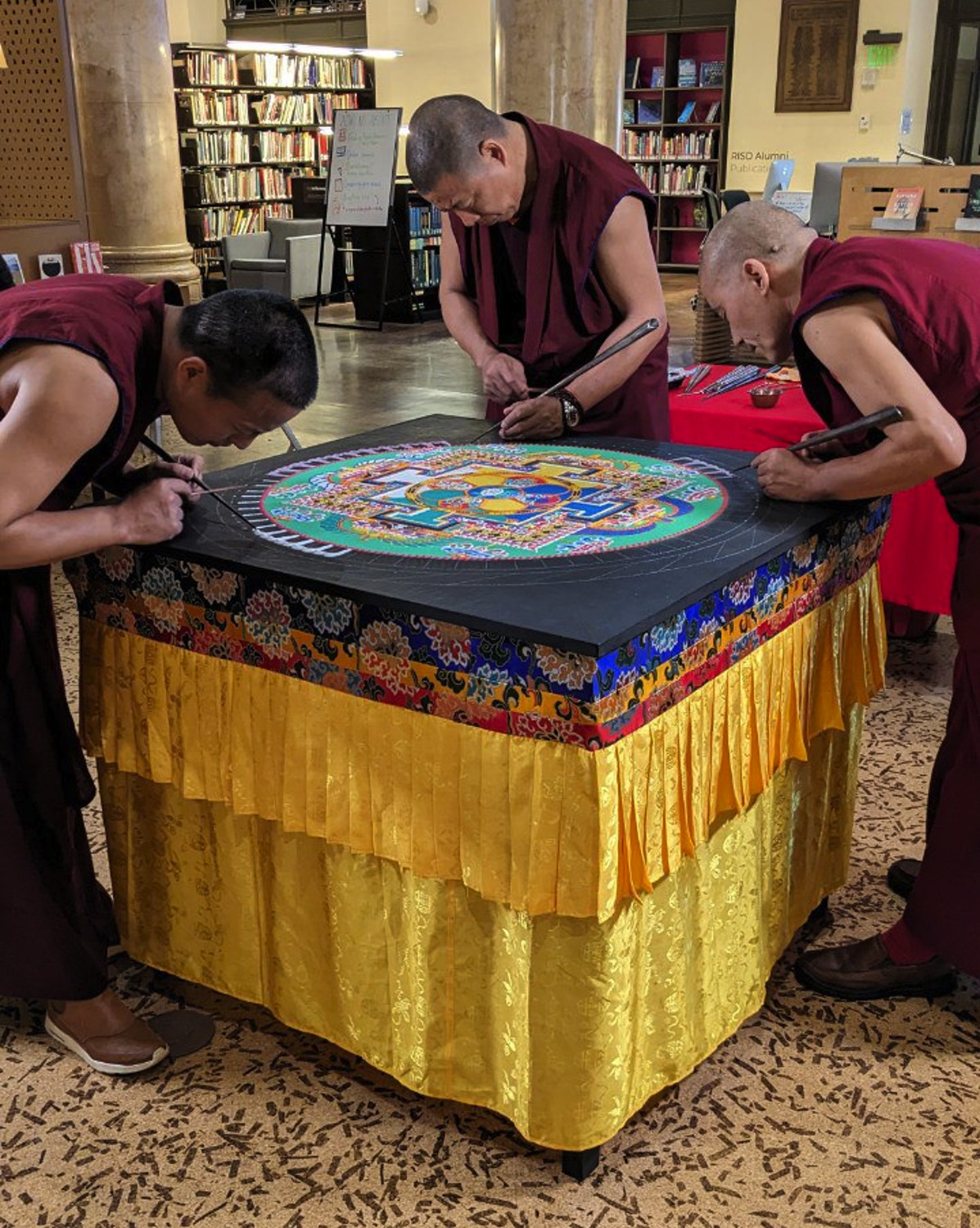 Monks working on the sand painting